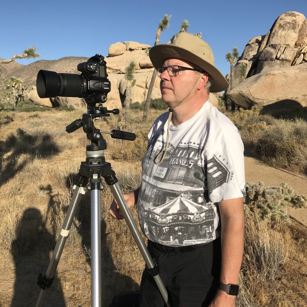 Geoff Allen, with camera, in Joshua Tree National Park
